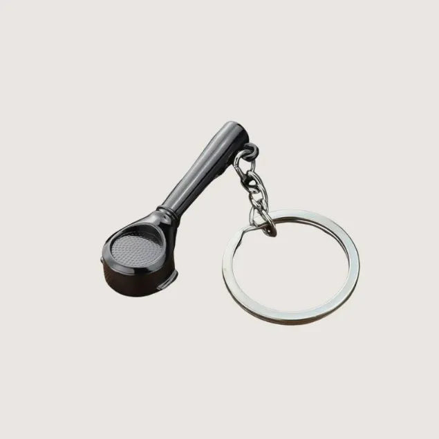 a black metal coffee bottomless portafilter keyring